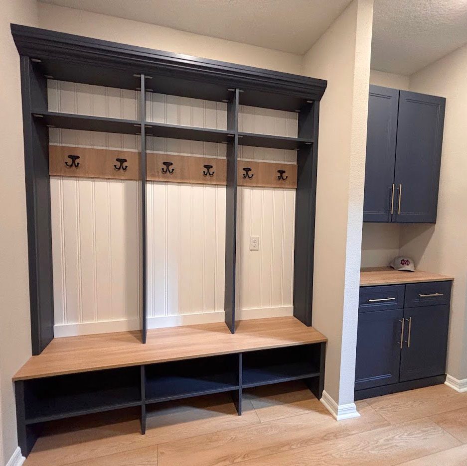 White mudroom lockers with bench seating and storage